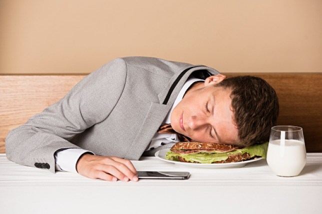 A boy sleeping on a sandwich